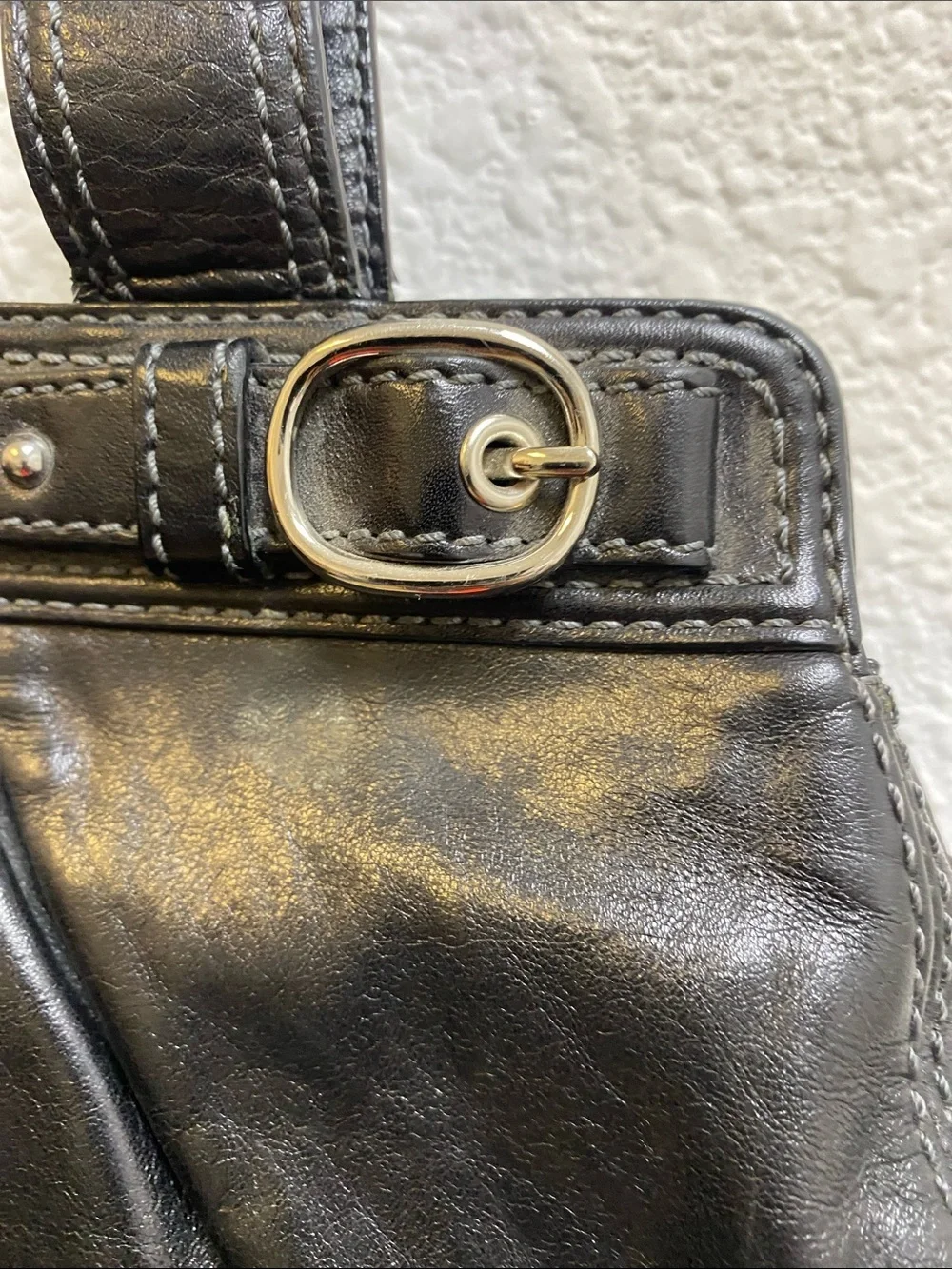 Coach Garnet F13914 pleated shoulder bag with a silver turn lock closure.
